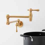 Signature Hardware 488316 4.6 GPM Double Handle Wall Mounted Retractable Pot Filler - Brushed Gold