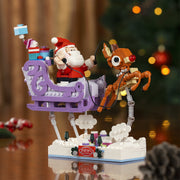 Brickcraft Rudolph The Red-Nosed Reindeer Santas Sleigh Building Kit, 586-Piece Holiday Collectible, Purple Sleigh with Santa and Rudolph Figures
