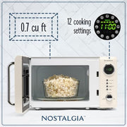 Nostalgia NRMO7IVY6A Retro Compact Countertop Microwave Oven 0.7 Cu. Ft, Ivory
