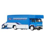 Hot Wheels Team Transport Toy Vehicle Set, Ford Capri GR5 Race Car with Fleet Flyer Transporter Truck, Blue, Real Riders Rubber Tires, Metal Construction, 1:64 Scale, JHX89